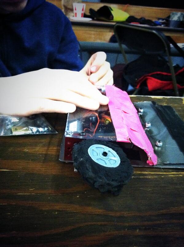 OriginalGeekMom's tweet image. We had some damage, but TrashBOaT survived his first day of battle. #robotbattles