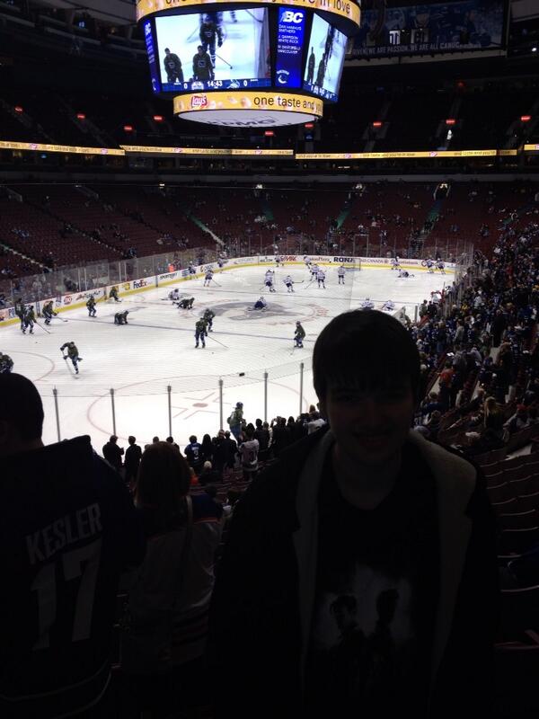 At Canucks game with my son. Check out the military sweaters!