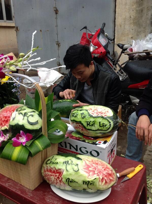 HanoiCooking's tweet photo. Fruit carving on the streets of #Hanoi #Tet. http://t.co/9idVcqSLxn