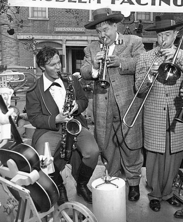 Stan_And_Ollie's tweet photo. 1943: During a break from filming #JaneEyre... Orson Welles jamming with #LaurelAndHardy on the set of Jitterbugs. http://t.co/K19TofIpSY