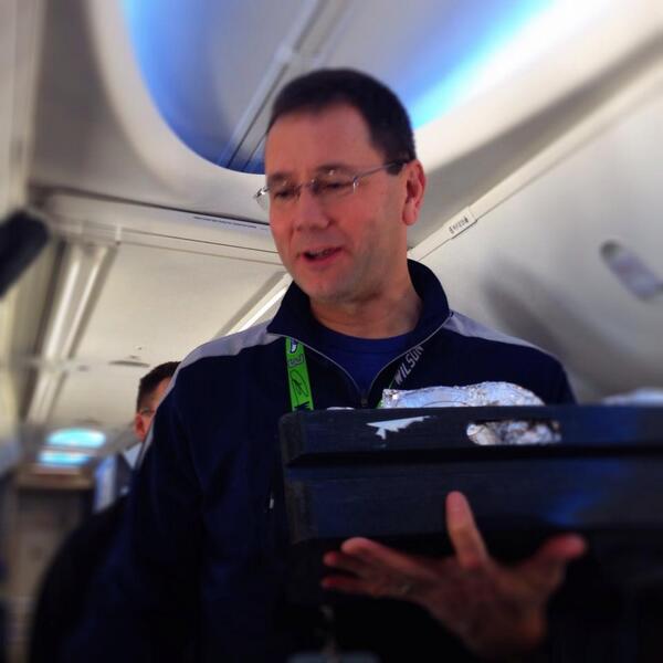 AlaskaAir's tweet photo. Our CEO, Brad Tilden, is serving up breakfast for our guests onboard the #12thFanAirlift. http://t.co/LQVfCgj4oQ