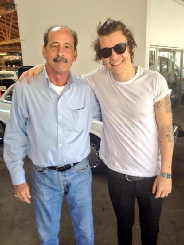 Harry bought this man's car the other day in LA! (Probably the white vintage one at the back)