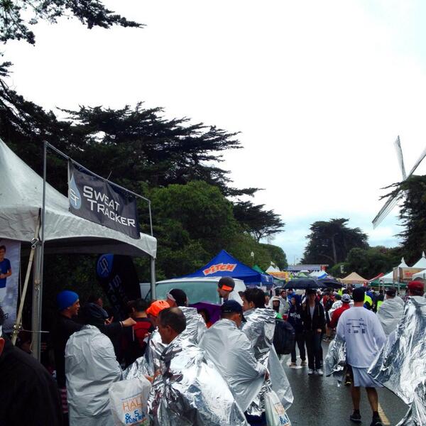 sweattracker's tweet image. Wet, happy #PRChallenge finishers at #kpsfhalfmarathon!