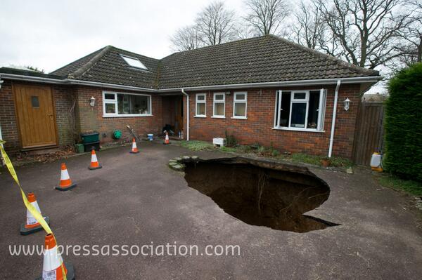 thejournal_ie's tweet photo. Well hole-y god: This 30ft sinkhole swallowed a car in front of this couple's home yesterday: http://t.co/J17heh8Ax4 http://t.co/8V8HLqfnVC