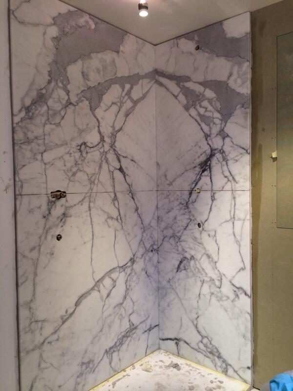 felixtiling's tweet image. Book matched marble in residential shower wall , Sackville St London