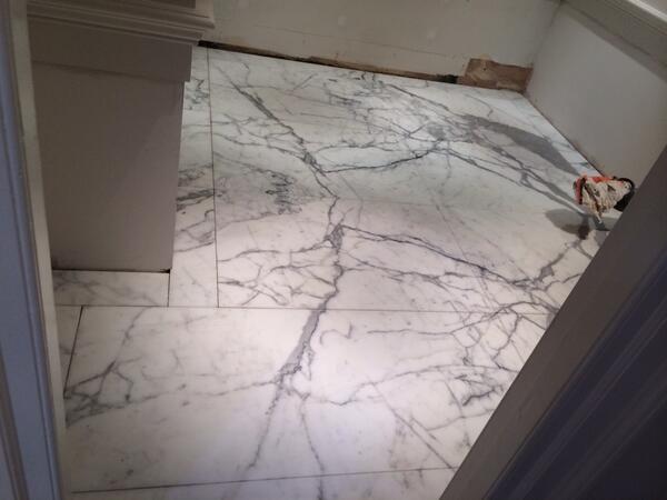 felixtiling's tweet image. Book matched marble in residential bathroom floor , Sackville St London