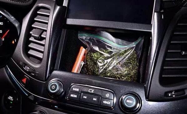 OfficerResource's tweet photo. Heads up: The new Chevy Impalas have a factory built compartment behind the LCD screen. http://t.co/6lq0BAj7Pp