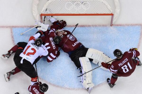 EarthsPic's tweet image. Latvian goalie Gudlevskis with astonishing save #Latvia #CANvsLAT