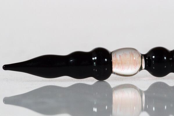tydyeglass's tweet photo. close up shot. this is a black glass dabber with 24k gold fume in the middle! http://t.co/F1BJiscG4f