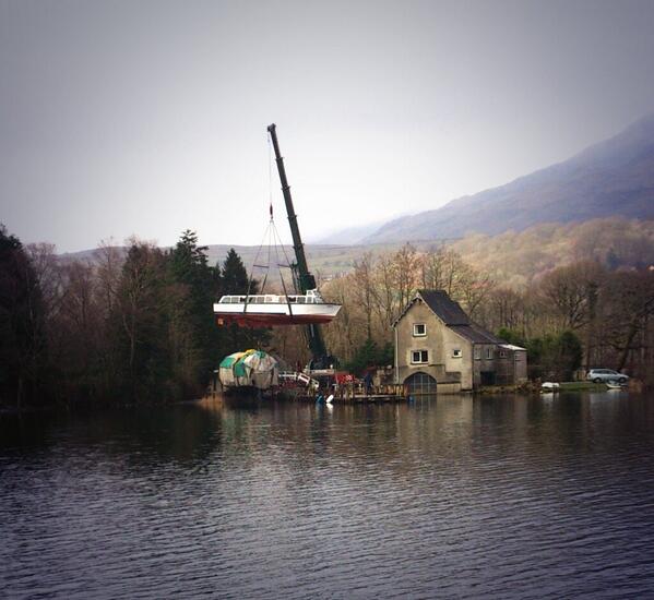 Cygnet being craned off the water at Pier Cottage to have a bit of winter work done