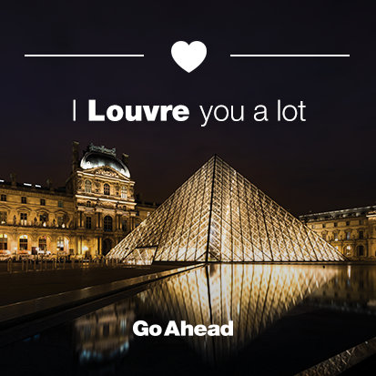 a glass pyramid in front of a building