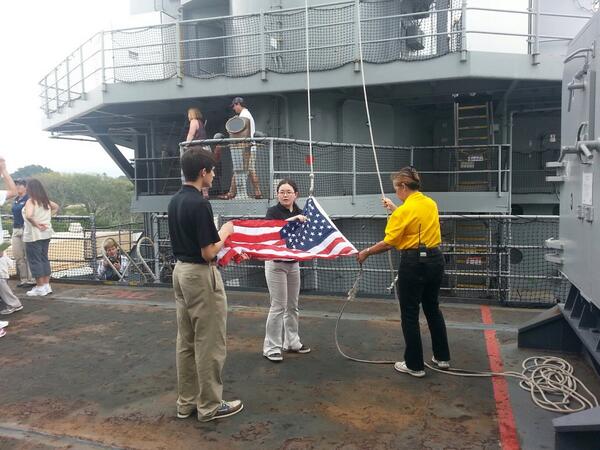 tylerkelsey's tweet photo. #phshawaii Aisulu and Mark raise the Flag on the USS Missouri while the band and orchestra play Stars and Stripes http://t.co/nIrUWFHKW9
