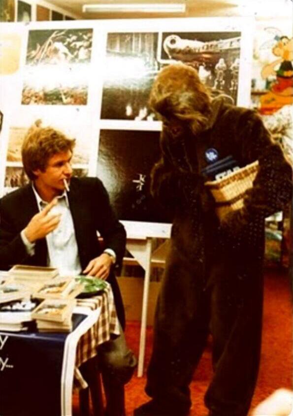 Thisisnotporn's tweet photo. Harrison Ford asking a fan, dressed up as Chewbacca, for a lighter. http://t.co/dx7d1TVu3l