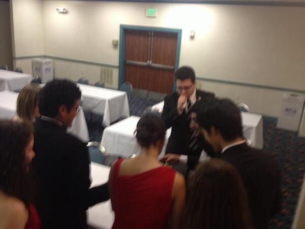 FLCSTwentyFour's tweet photo. Delegates in 24 huddle around a combination-locked briefcase attempting to crack its code #FLCSIII #twentyfour http://t.co/F2wNNRXyvA