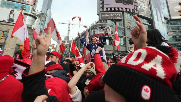 SteveRussell's tweet photo. PARTY! @CDNOlympicTeam fans take over the intersection at Yonge &amp; Dundas in #Toronto to celebrate #Sochi2014 Gold. http://t.co/ADLqfQBzi9