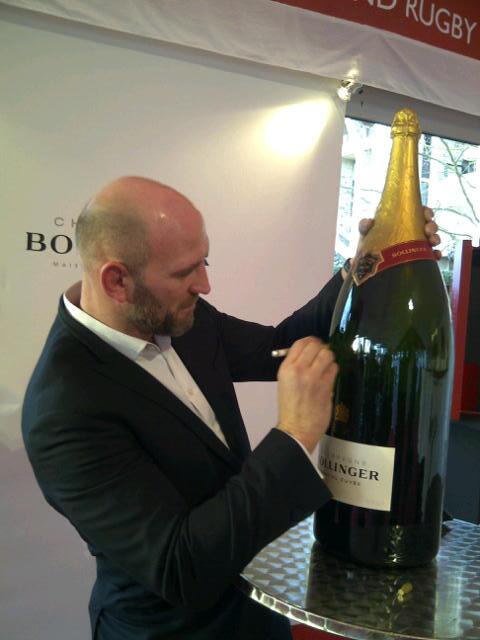 DFWineClub's tweet photo. @dallaglio8 signing the #BollingerBigBoy @BollingerUK donating £1.50 if  you tweet &amp; follow them &amp; @dallagliofdn http://t.co/77eaxkAwI8