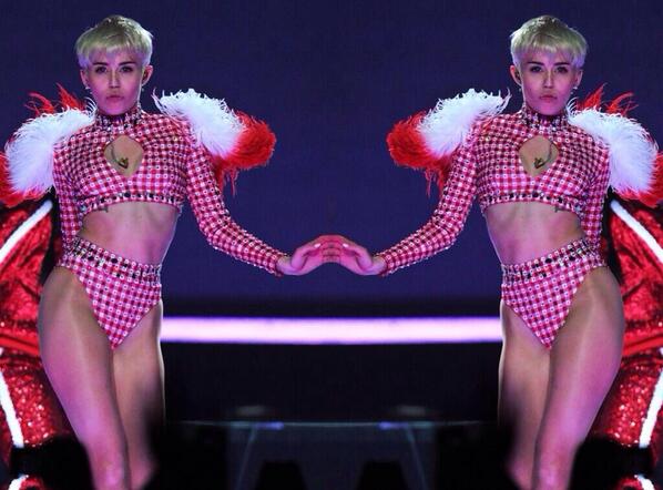 MileyCyrus's tweet photo. Cat walk. Slick talk. Flirtin with them BIG dogs. Why I need his millis when I got Billy on the speed dial. #bangerz http://t.co/nUWHSNETVy