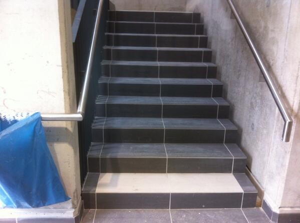 ac_flooring's tweet photo. Porcelain tiling to 12 stair cores. Looking good http://t.co/7pAkAlPNGb