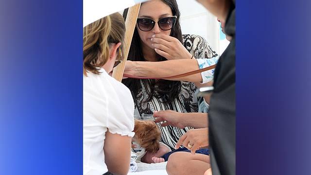 Simon Cowell and Partner lets Dog lick 16 day old baby's face