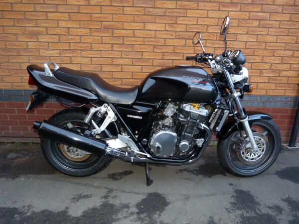 The other love of my life 1994 Honda CB1000FR Super Four Big One keep the beer by it as an excuse to visit the garage