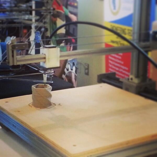 FloridaState's tweet photo. A 3D printer is making ceramics at the Stacking Layers event! Check it out yourself: http://t.co/TY04EQqkNQ! #fsu3d http://t.co/t5BXBzrTxG