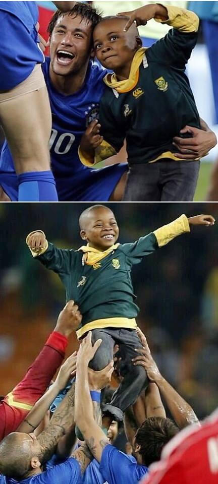 GaryLineker's tweet photo. “@FootballFunnys: Neymar with the  7 year old Ayo Dosumu of South Africa who invaded the pitch. http://t.co/v11mocFnMQ” < Love this!
