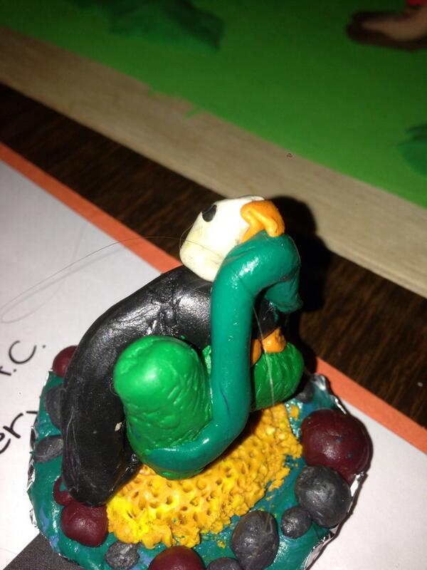 Clay model of an Eagle sitting on a cactus, eating a snake. Aztec origin story.