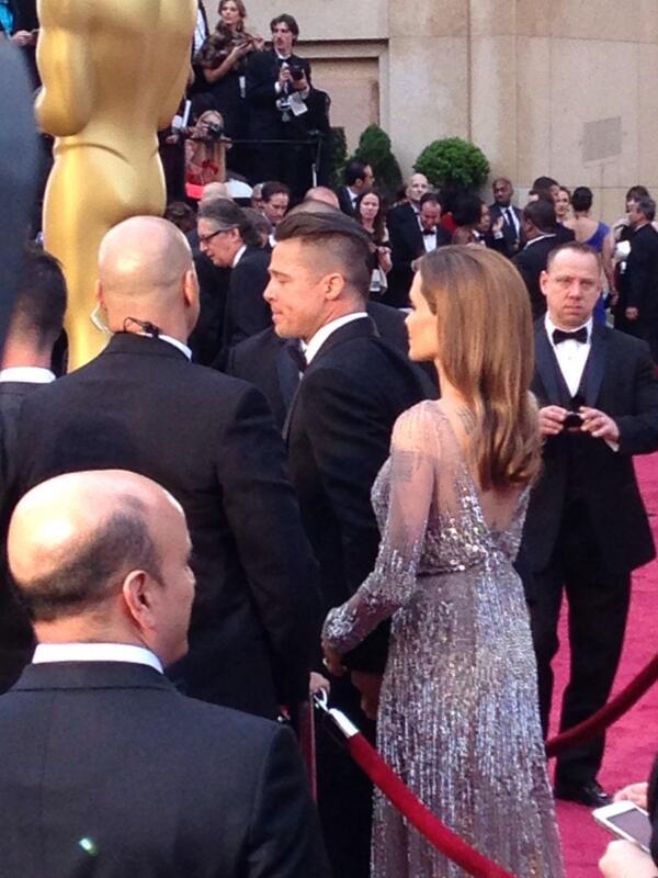 EW's tweet image. The prom King and Queen: Brad Pitt and Angelina Jolie #Oscars