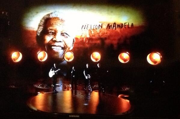 #U2 gets standing ovation after performing #Oscar- nominated song "Ordinary Love" from #Mandela.