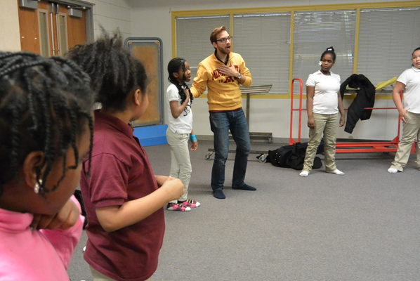 ComMUSICation promotes peer to peer teaching. Students LOVE volunteering to help music director Ryan teach the class.