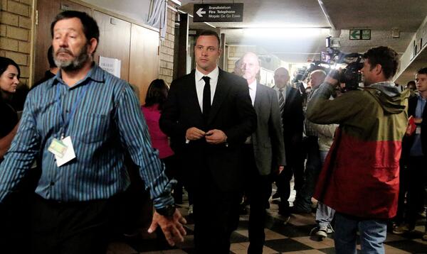 barrybateman's tweet photo. RT @ewnreporter: #OscarPistorius is escorted into the Pretoria High Court ahead of his murder trial. SM http://t.co/AWl14P3WKM