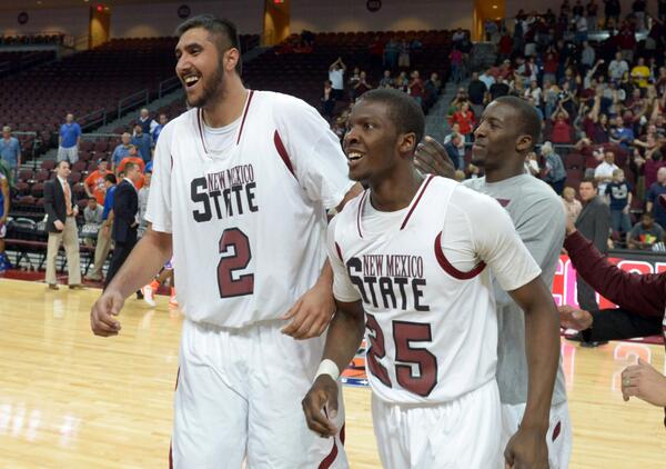 SBNation's tweet photo. New Mexico State wins the WAC! They have Sim Bhullar, who is STANDING NEXT TO A 6’9 PERSON IN THIS PHOTO http://t.co/3nPWaXsY7X