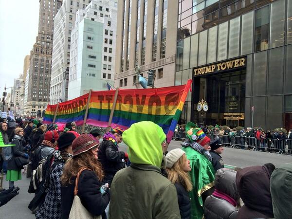 tonymerevick's tweet photo. Giant rainbow banner facing the parade reads, "BOYCOTT HOMOPHOBIA!" as activists protest LGBT exclusion. http://t.co/uSNRaG4uqQ