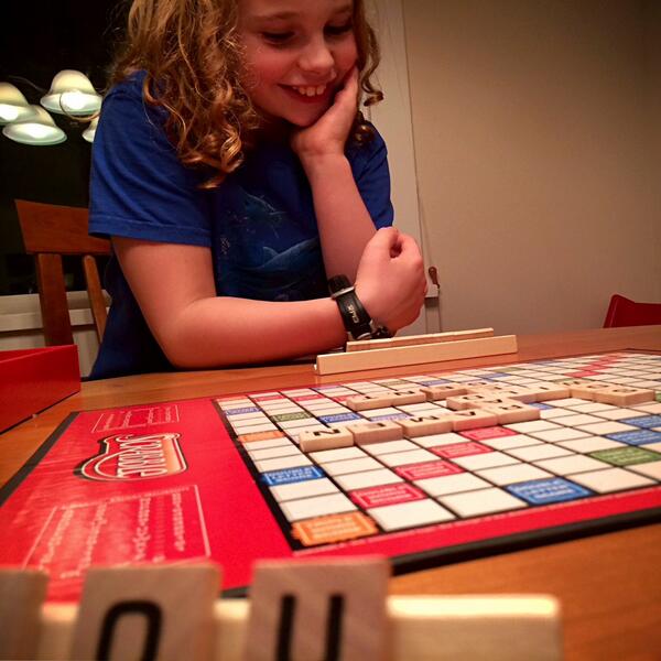 dodgemc's tweet photo. And so it begins: my son's scrabble initiation. thanks to @hodgman he already knows better than to spam the engine. http://t.co/01qFRQBH0p