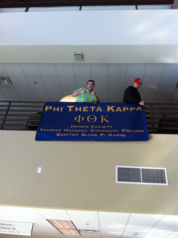 Isarkie's tweet photo. VP of Fellowship Ryan Maloney @tallguy1245 hanging the @PhiThetaKappa banner at the club fair #PTKSELFIE http://t.co/JUpObh7UIq