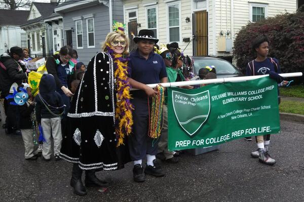 SylvanieES's tweet photo. SWCP Principal Heidi Melancon leading the way during the NOCP Mardi Gras parade last week. http://t.co/r9bYaFvWFg
