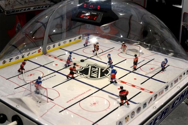 WIRED's tweet image. This classic bubble-hockey table comes with a "boo" button you can use to rattle your opponent wrd.cm/1k1ad8T