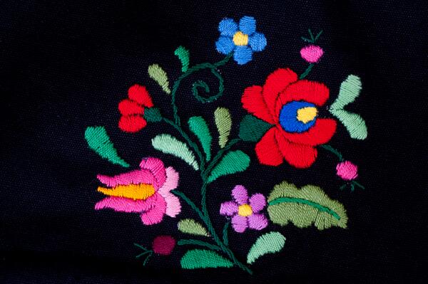 More inspiration on a bag handmade by Hungarian ladies. I love the bold colours on the black background!