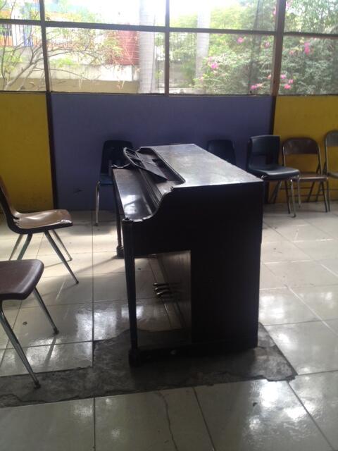 SingWithHaiti's tweet photo. Here's one of the only pianos left at L'Ecole de Musique. The school's grands were destroyed, and need to be replaced http://t.co/HrrAeuwAtE