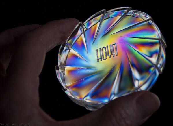 DaveHenniker's tweet image. Clear plastic Hoya filter box lid lit by polarized light and photographed through polarizing filter #photoelasticity