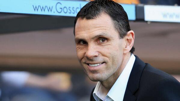PIC: Gus Poyet takes his seat in the dug-out
