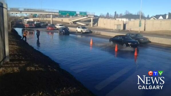 CTVCalgary's tweet photo. City of Calgary road crews are attempting to drain a massive puddle on southbound Crowchild Trail south of 33 Ave SW http://t.co/FdeaJDQbl1