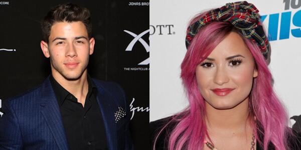 peopleschoice's tweet photo. .@nickjonas surprised fans by joining @ddlovato on stage at her concert! Watch their duet: http://t.co/X3tRUoawoO http://t.co/phkIclUY2J