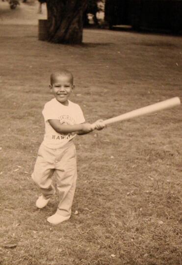 Obama swinging a baseball bat