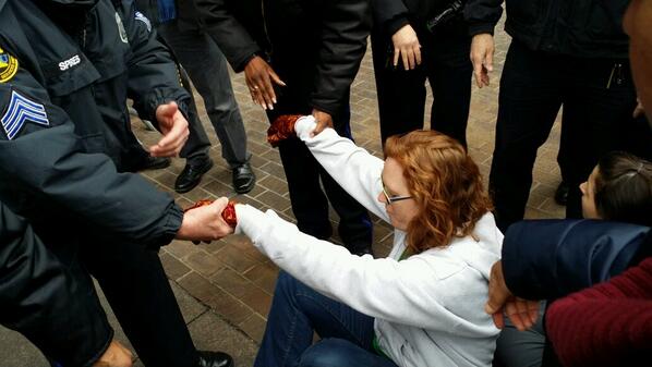 EnviroAction's tweet photo. Ingrid of @eqat takes a stand by sitting down #xldissentphilly #nokxl http://t.co/2RSmPhszDA