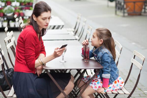 Image result for parents ignoring their child at table