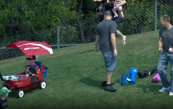 BleacherReport's tweet photo. VIDEO: Man sends a child down the hill in a wagon as he goes for a baseball http://t.co/cVql5HZtfQ http://t.co/3wggwkjPC7