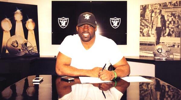 ESPNNFL's tweet photo. It's official!! -- Justin Tuck signing his new contract making him a member of the Oakland Raiders. 
(via @CJLaboy) http://t.co/TeFF0fbWim