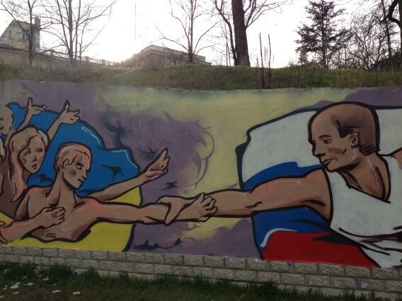 RichardEngel's tweet image. Mural showing heroic putin reaching out to save people of #crimea