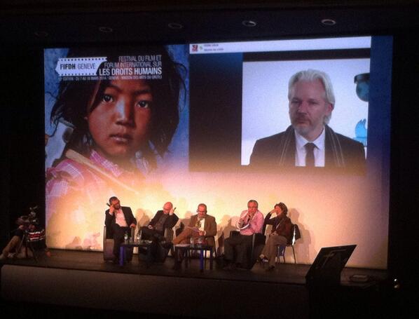 ShyGe's tweet photo. Julian Assange at the FIFDH (Geneva) via Skype. http://t.co/TpOkT0WCEu